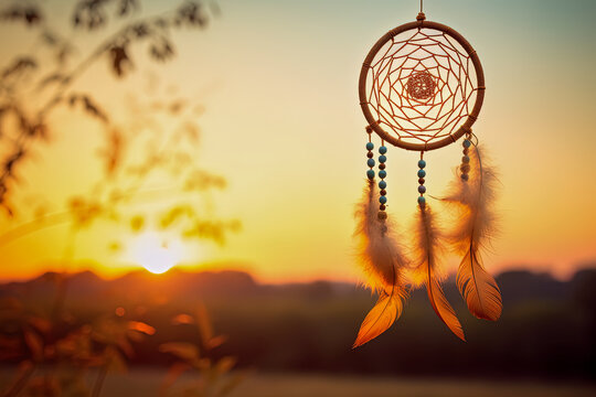 Indian dream catcher hanging in the morning light with a blurred background