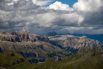 Obraz premium Panoramic view from the top of the Marmolada Glacier in summer mist, Dolomites, South Tyrol, Italy.