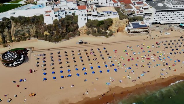 Drone shot of the beach in Algarve.. A big one full of Brits.