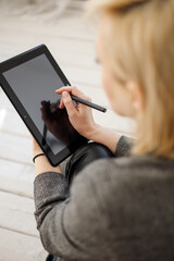 Graphic tablet with stylus, graphic designer, working using pen tablet, creative working with digital pen on monitor, a female graphic designer designing her graphic artwork on digita