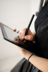 Graphic tablet with stylus, graphic designer, working using pen tablet, creative working with digital pen on monitor, a female graphic designer designing her graphic artwork on digita