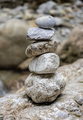 Fototapeta na wymiar Stacked zen stones in Cheile Oltetului gorge