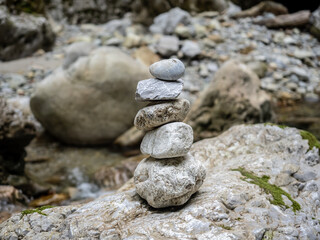 Fototapeta na wymiar Stacked zen stones in Cheile Oltetului gorge