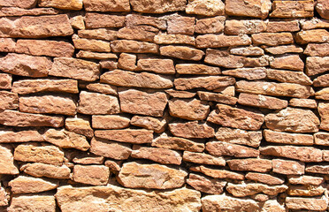 Ancient stone bricks in the wall as a background. Texture
