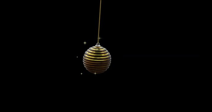 Black and gold christmas bauble swinging with gold sparkles on black background