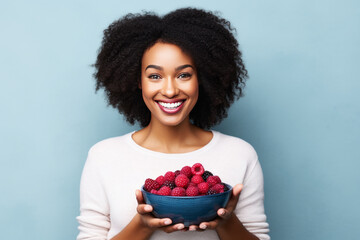 Black woman eating healthy fruit and berries