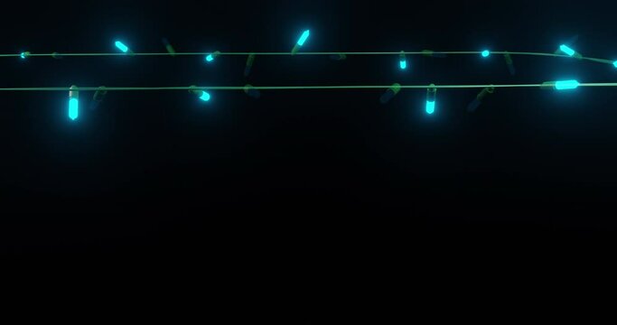 Blue christmas string lights flashing on black background, copy space