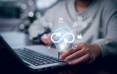 Light bulb with Infinity symbol with technology global marketing online in business connection network economy strategy of investment, banking and financial data exchange for business growth.