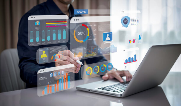 Businessman using a laptop with Analytics and Data Management Systems  Analyst working in Business Analytics and Data Management Systems to make reports and corporate strategy for finance, operations