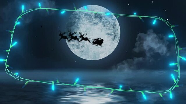 Blue christmas string lights flashing over winter scene with santa passing full moon in sleigh