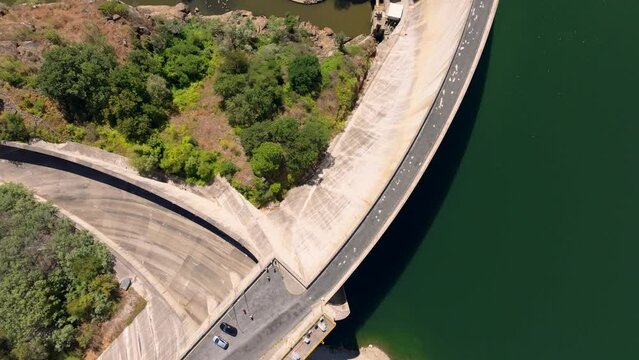 Flying Above Concrete Wall Of Belesar Dam On Minho River In Lugo, Spain. aerial topdown