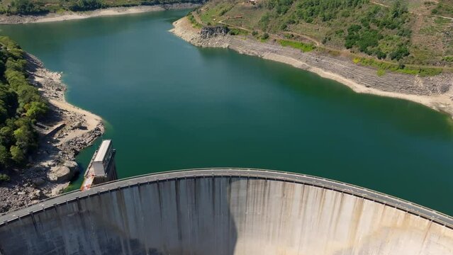 Concrete Belesar Reservoir with Calm Waters On A Sunny Day In Lugo, Spain. - aerial