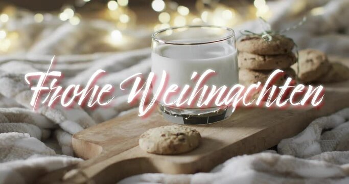 Frohe weihnachten text in white over christmas cookies and milk with bokeh lights