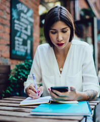 hipster girl chatting researching information for test