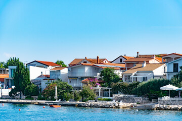 Fototapeta na wymiar Croatian seaside town with houses with red roofs