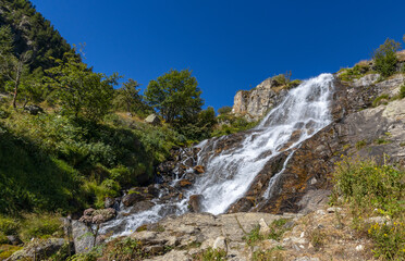 Fototapeta na wymiar View of Pisciai waterfall in the municipality of Vinadio, province of Cuneo, Piedmont, Italy.