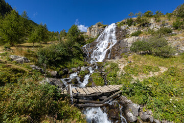 Fototapeta na wymiar View of Pisciai waterfall in the municipality of Vinadio, province of Cuneo, Piedmont, Italy.