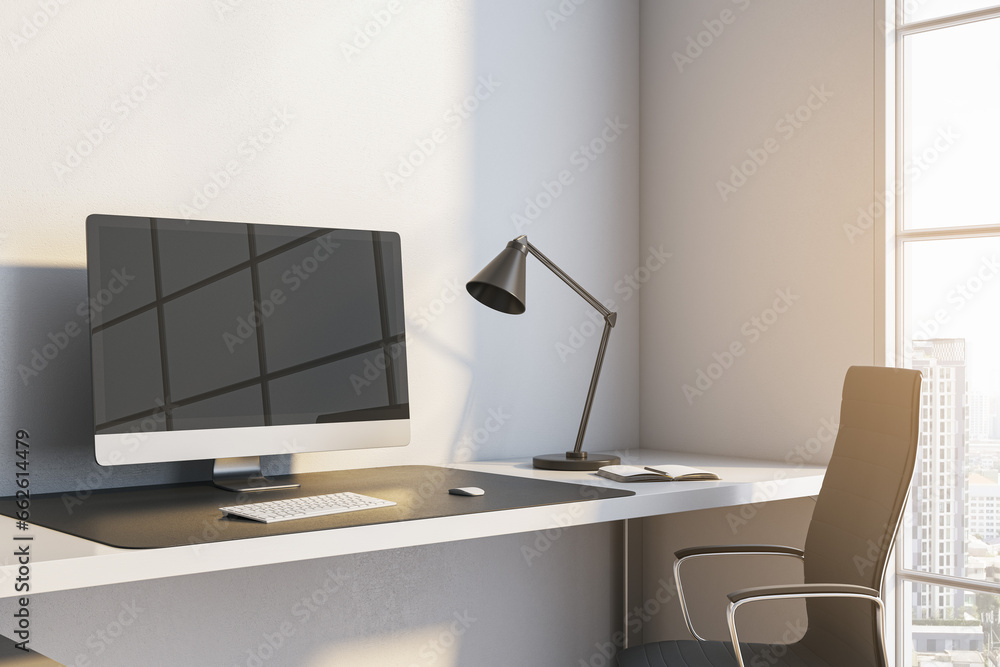 Poster Close up of modern workplace with reflections on computer monitor, lamp and window with city view and daylight. 3D Rendering.
