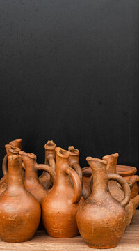 Close-up of assorted handmade jugs (amphora)