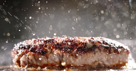 Beef cutlet for halal burger fried in frying pan. Cinematic advertising burger cooking. Well-fried cutlet in frying pan, fragrant steam, splashes of hot bubbling fat. Close-up of delectable cutlets