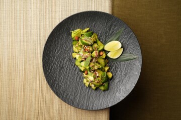 Avocado salad with fresh cucumber almond, close-up