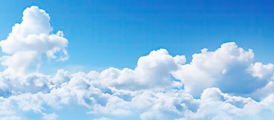 Cloud clusters scattered in blue sky With copyspace for text - obrazy, fototapety, plakaty