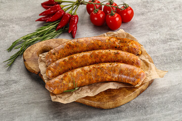 Raw sausages with spices and herbs
