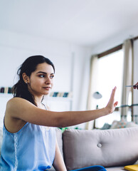Woman defiantly refusing credit card in hands of man