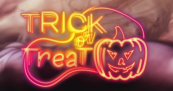 Animation of trick or treat text and pumpkin over pink smoke background