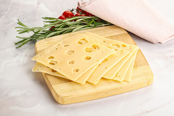 Sliced maasdam cheese with holes