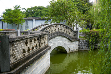 Fototapeta na wymiar Stone bridge in a private garden during the Republic of China in Longzhou, Guangxi, China
