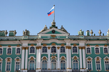 Fototapeta na wymiar The main facade of the Winter Palace with the Russian flag on the spire. Saint Petersburg