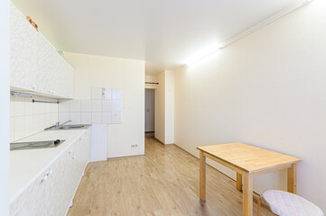 interior apartment kitchen and dining room, refectory area, cooking equipment, table furniture, stove