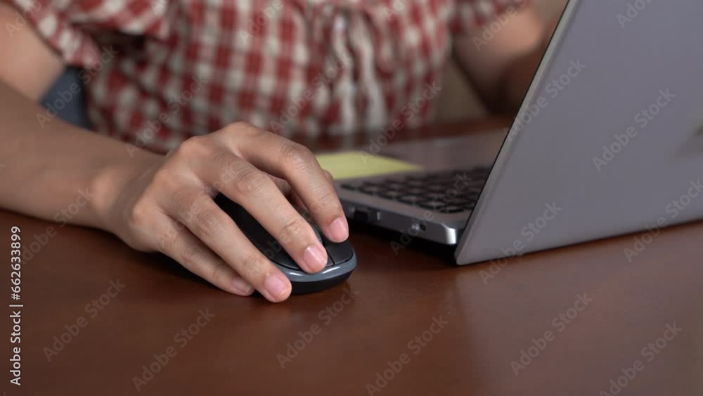 Poster close up of hands of a woman sitting at home working on a desktop computer. creative man using mouse