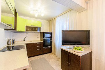 interior apartment kitchen and dining room, refectory area, cooking equipment, table furniture, stove