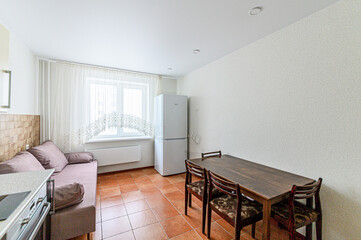 interior apartment kitchen and dining room, refectory area, cooking equipment, table furniture, stove