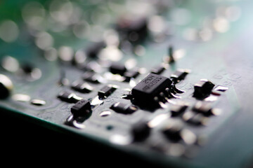 Green electronic circuit board close up. Macrophotograph.
