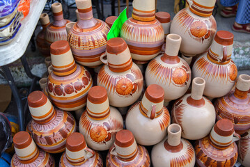 Group of ceramic pots in a street market in Mexico. - obrazy, fototapety, plakaty
