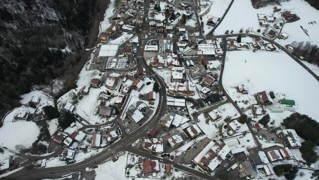 Heart of snowy ski resort town with road traffic