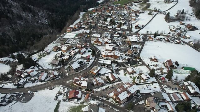 Winter sunny aerial view of an alpine town center in France