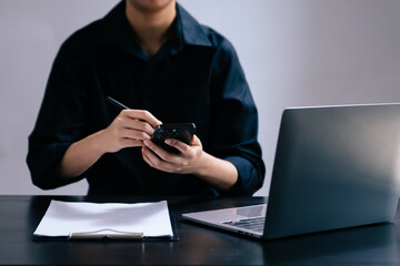 Businesswoman hand using laptop, tablet and smartphone in office. Digital marketing media mobile app and discussing plan new start up project.