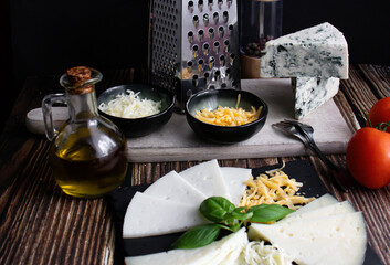 different types of cheese. Italian cuisine. wooden background. a snack
