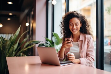 Happy female student sitting in a coffee shop, using a smartphone or business, online shopping, transfer money, financial, internet banking. in coffee shop cafe over blurred background. - obrazy, fototapety, plakaty