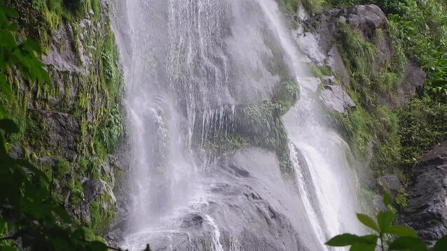 Cascade el Bejuco waterfall on mossy rock cliff in Honduras jungle