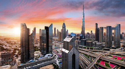Dubai downtown district skyline at dramatic sunrise, United Arab Emirates - aerial view - obrazy, fototapety, plakaty