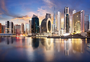 Dubai skyline with skyscraper and reflection in canal - nice cityscape in United Arab Emirates - obrazy, fototapety, plakaty