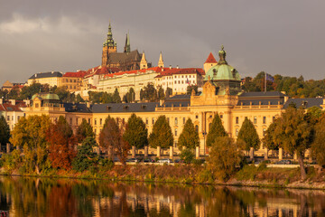 Autumn views from Prague. Picturesque autumn Prague in the morning sun. The Vltava River with the Charles Bridge, the waterfront and houses of Mala Strana and the dominant Prague Castle. Czechia