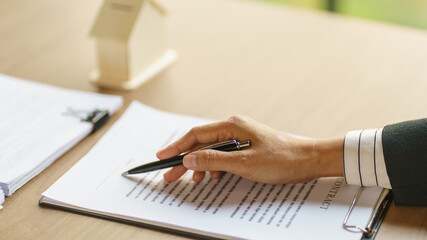 Approved stamp with Business people signing contract making deal with real estate consultant home...