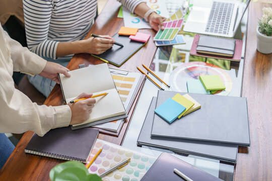 Teamwork brainstorming Creative idea Business project. Business People meeting taking notes while discussing with Color swatch samples to share idea