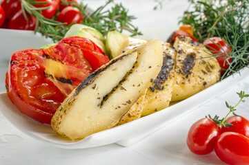 chopped halumi cheese with vegetables. Grilled barbecue cheese with tomatoes and zucchini. dietary, low-calorie dish.